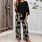 Set compus dintr-un top cu mâneci ¾ și pantaloni cu model